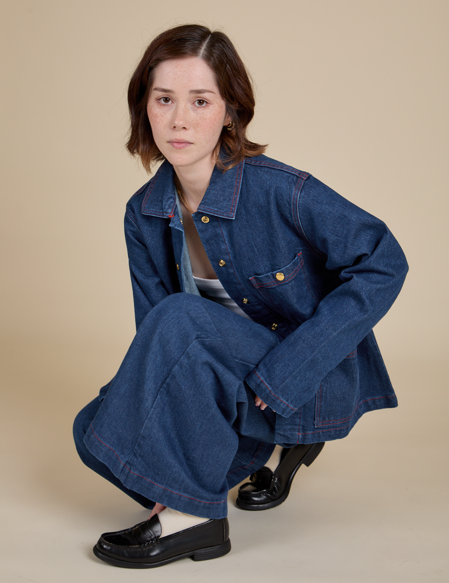 Hana is wearing Indigo Denim Work Jacket in Dark Wash