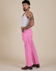 Side view of Work Pants in Bubblegum Pink and vintage tee white Cropped Tank on Jesse