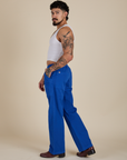 Side view of Work Pants in Royal Blue and Cropped Tank in Vintage Tee White on Jesse