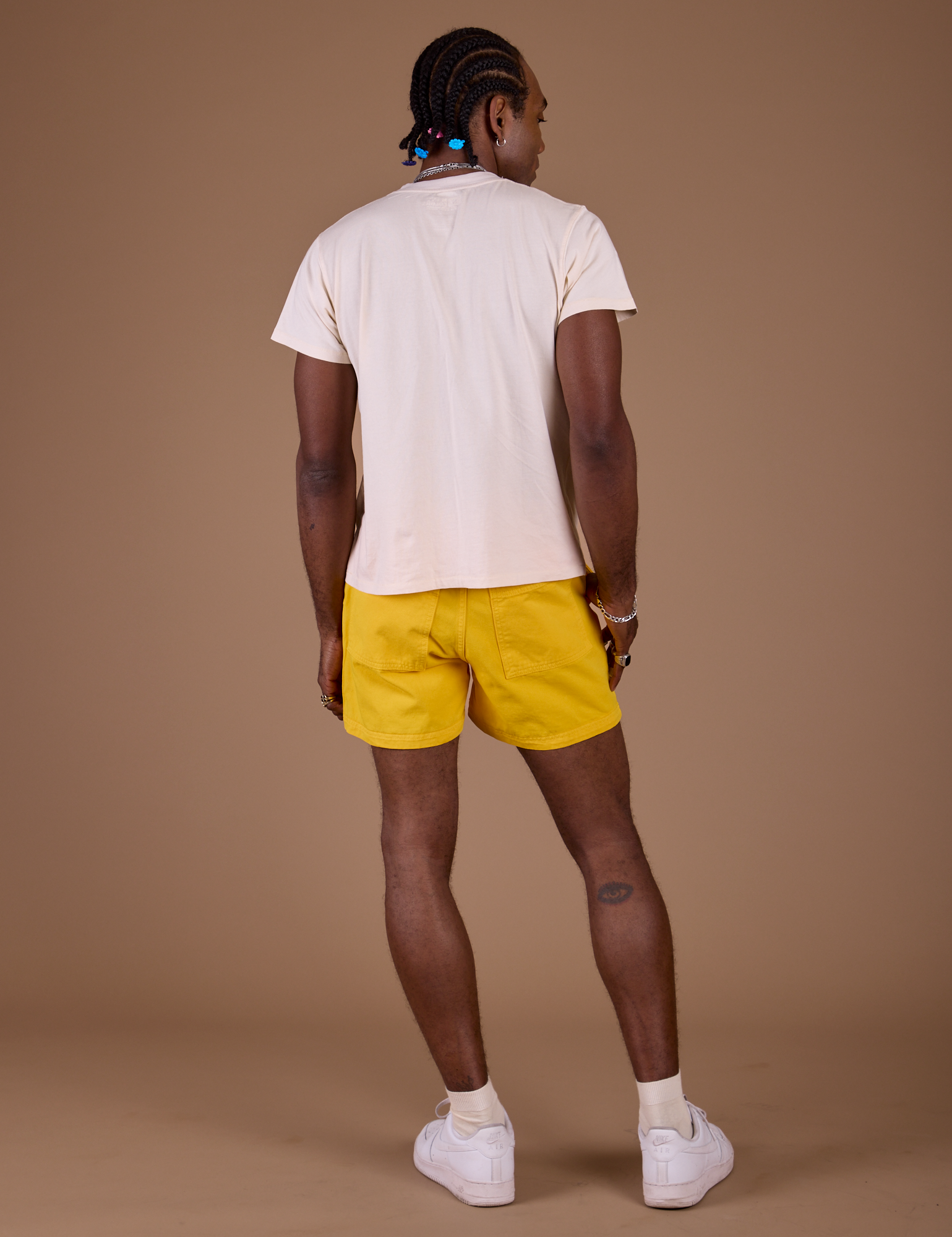 Back view of Classic Work Shorts in Sunshine Yellow and Organic Vintage tee in Vintage Off White on Jerrod