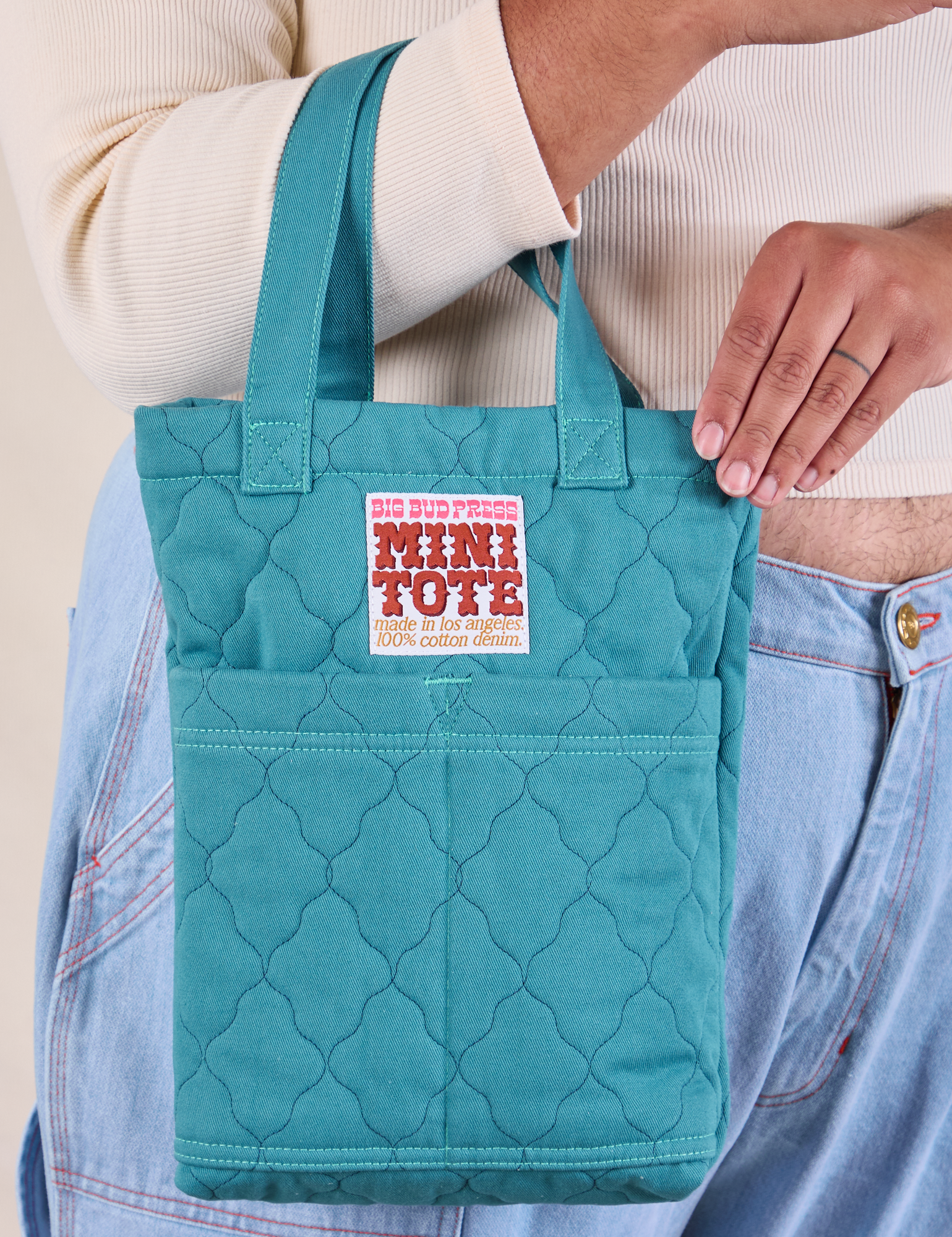 Quilted Mini Tote in Marine Blue on model&#39;s arm