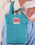 Quilted Mini Tote in Marine Blue on model's arm