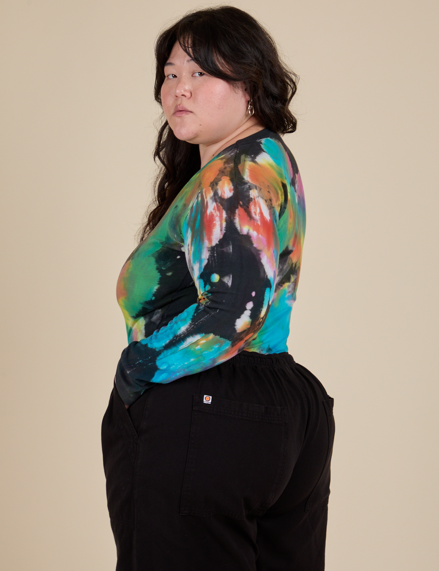 Long Sleeve Baby Tee in Rainbow Magic Waters side view on Ashley