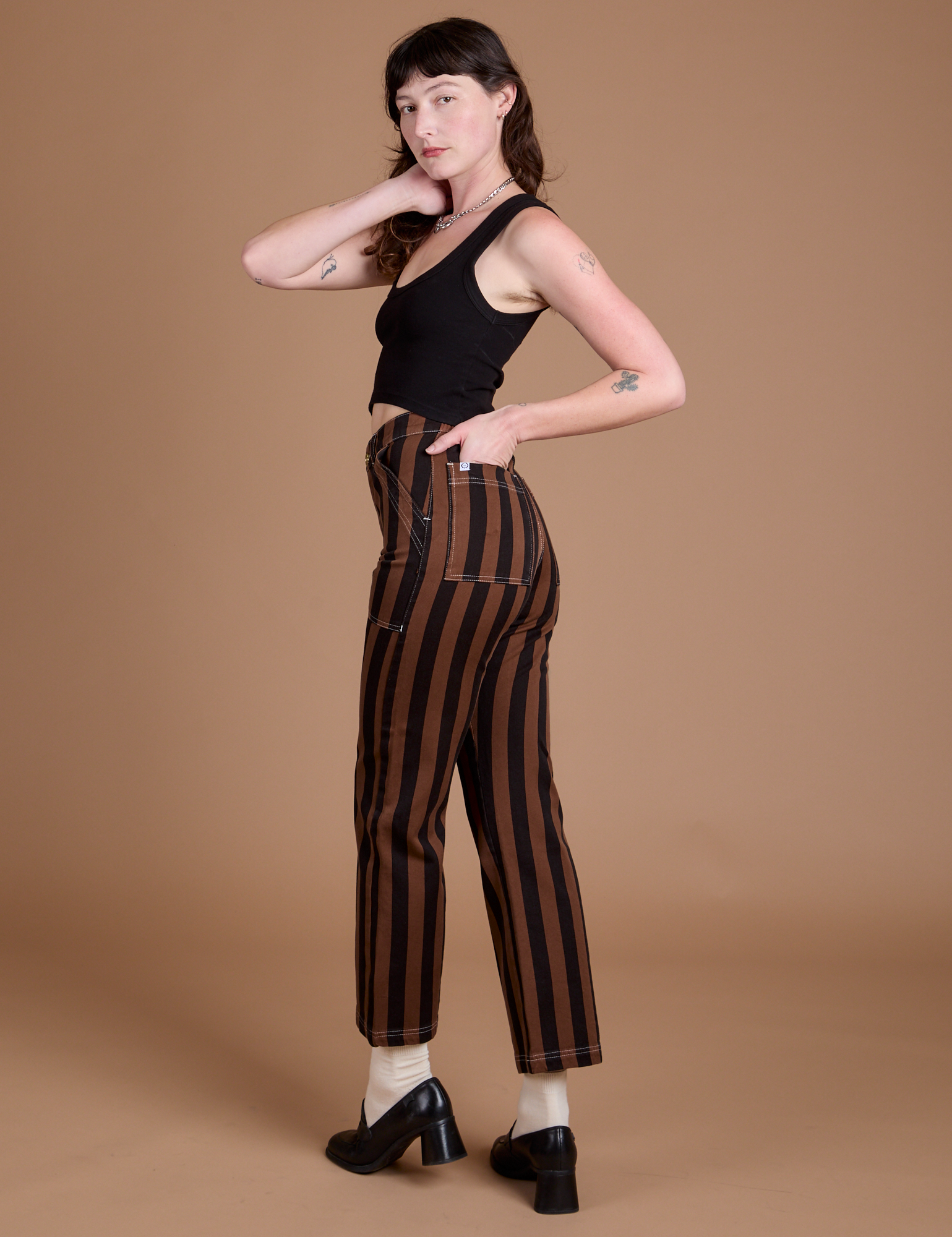 Angled back view of Black Stripe Work Pants in Fudgesicle Brown on Alex
