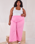 Morgan is 5'5" and wearing 2XL Action Pants in Bubblegum Pink paired with a Tank Top in vintage tee off-white