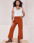 Jesse is 5'8" and wearing XXS Action Pants in Burnt Terracotta paired with Cropped Tank in vintage tee off-white