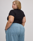 Angled back view of Baby Tee in Basic Black on Juliet