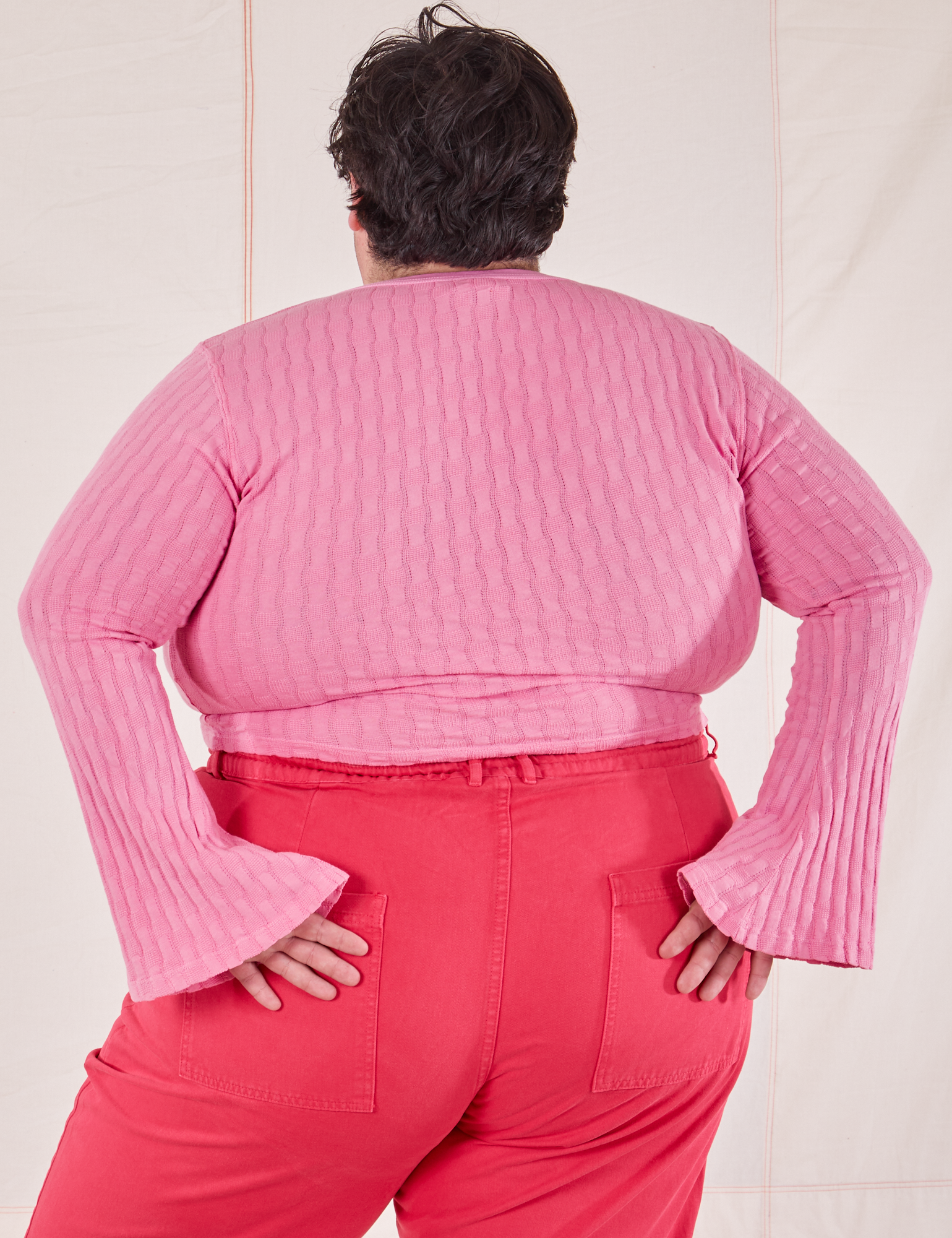 Back view of Bell Sleeve Top in Bubblegum Pink and hot pink Work Pants worn by Sam