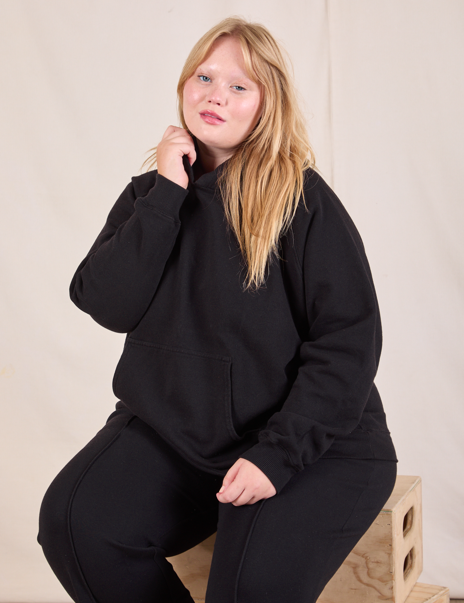 Juliet is wearing Oversized Hoodie in Basic Black