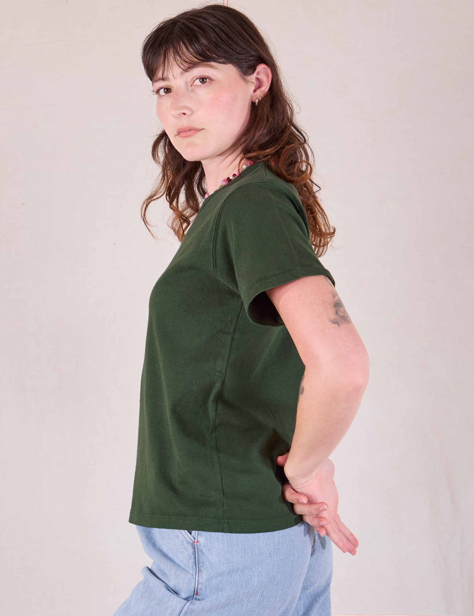 Burly Tee in Swamp Green side view on Alex