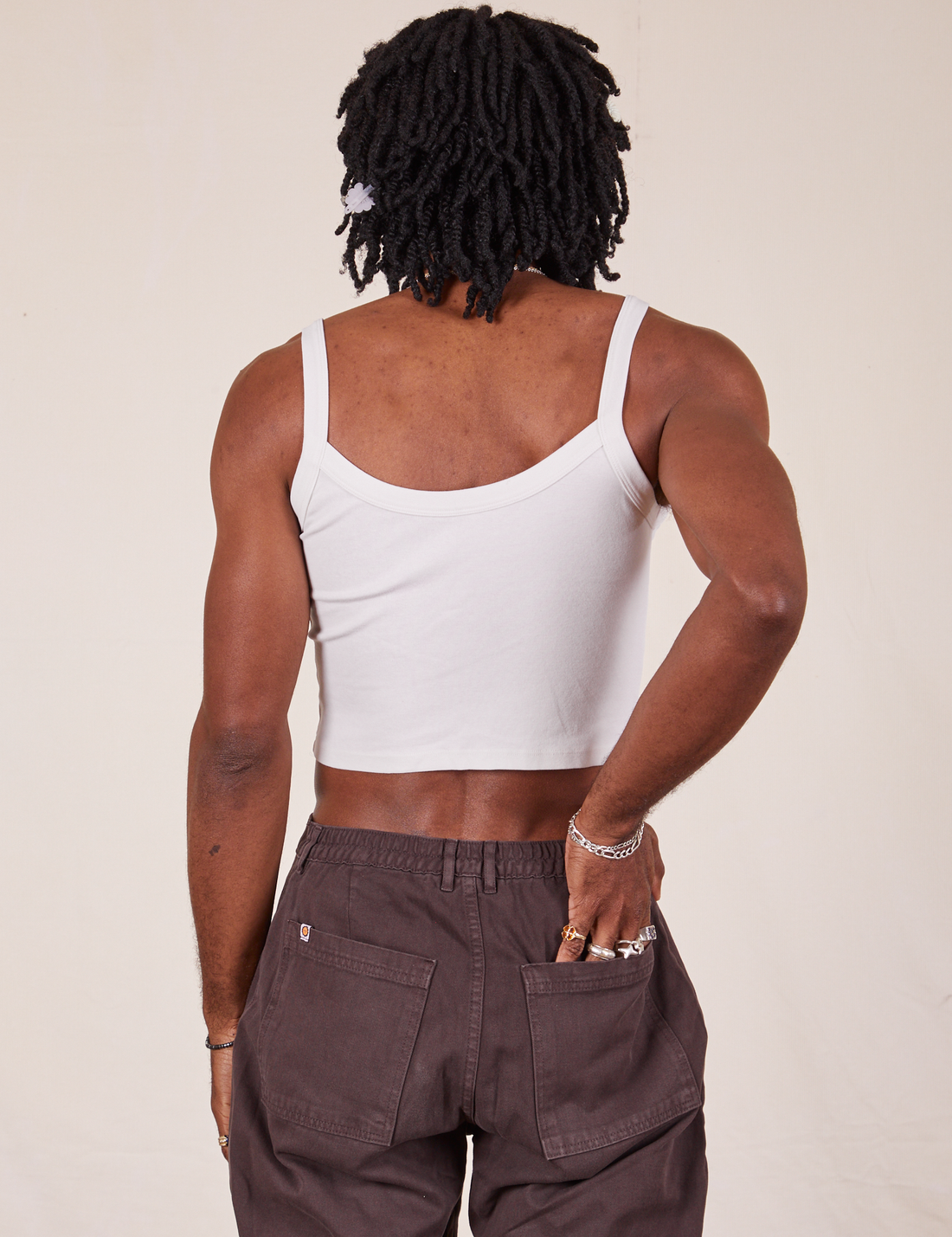 Back view of Cropped Cami in Vintage Off-White and espresso brown Western Pants worn by Jerrod