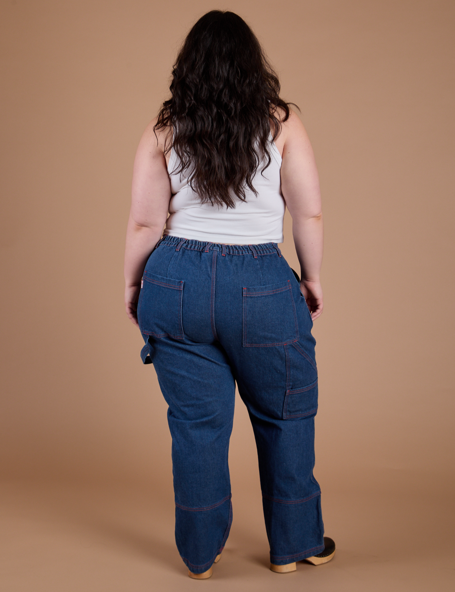 Carpenter Jeans in Dark Wash back view on Ashley