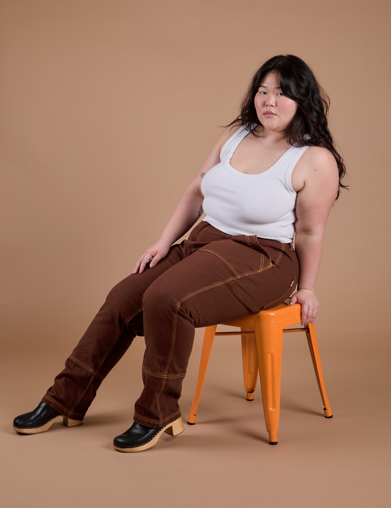 Carpenter Jeans in Fudgesicle Brown and Cropped Tank in Vintage Tee White on Ashley