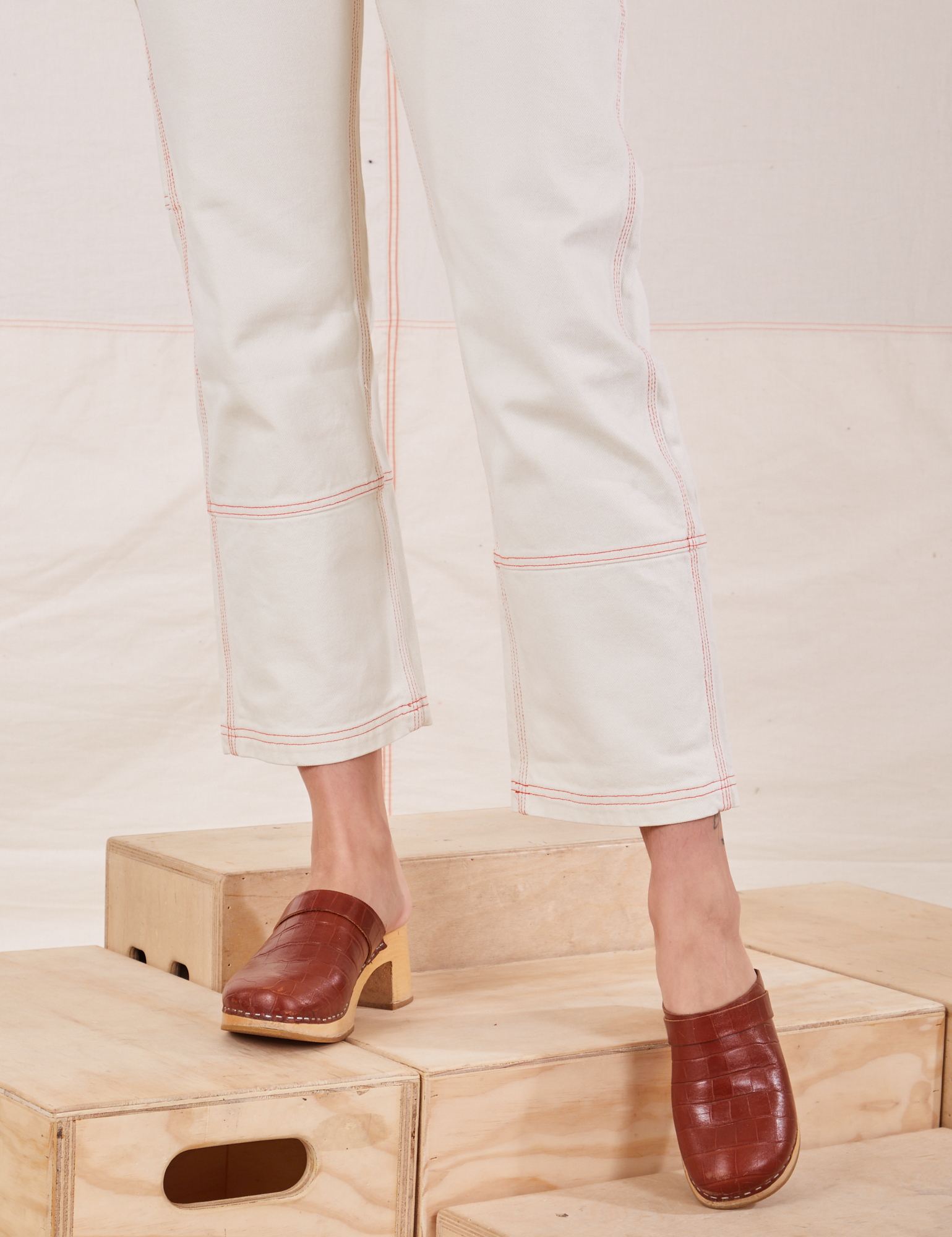 Carpenter Jeans in Vintage Off-White pant leg close up on Alex