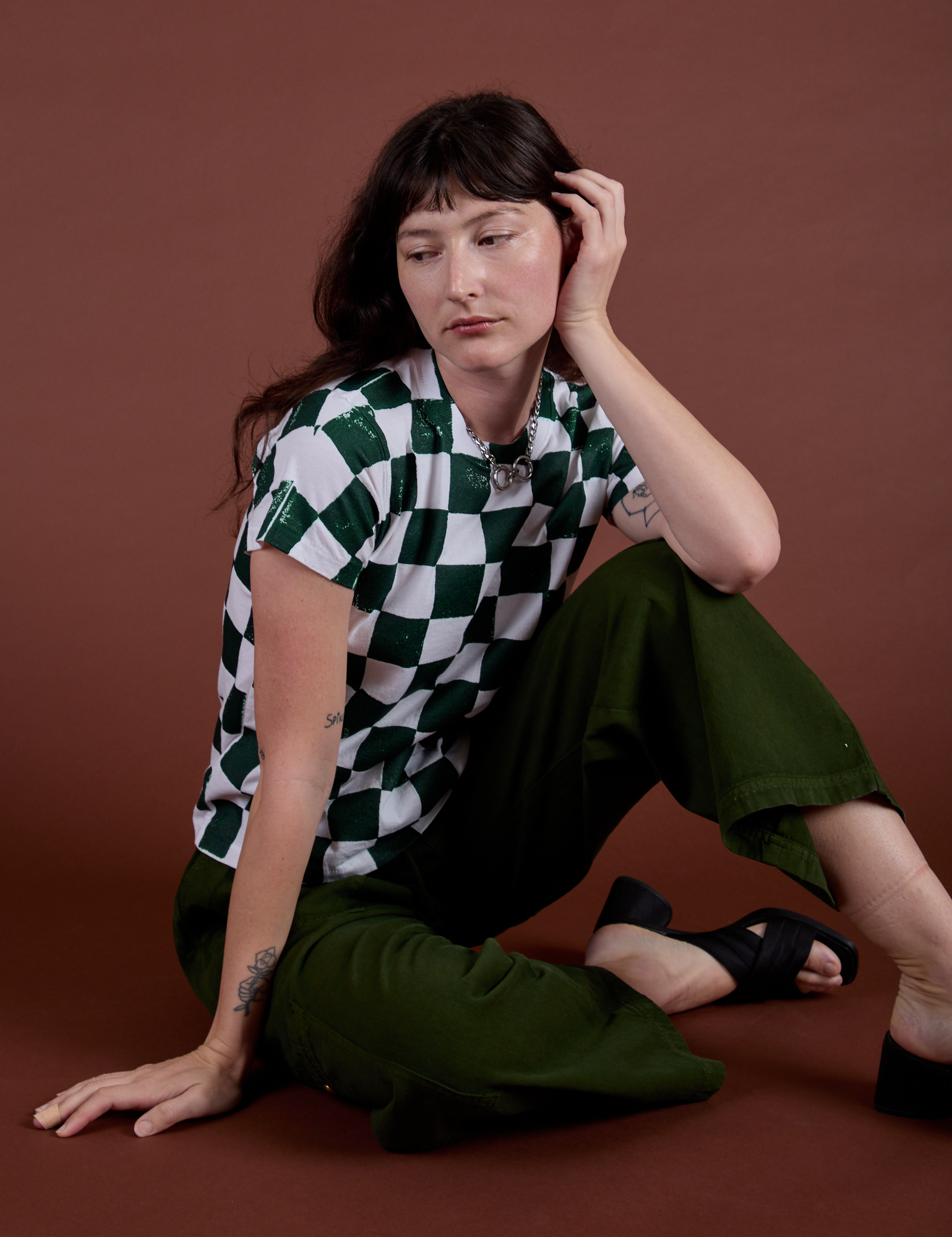 Checker Organic Tee in Swamp Green and evergreen Drop Pocket Cargo Pants worn by Alex