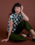 Checker Organic Tee in Swamp Green and evergreen Drop Pocket Cargo Pants worn by Alex