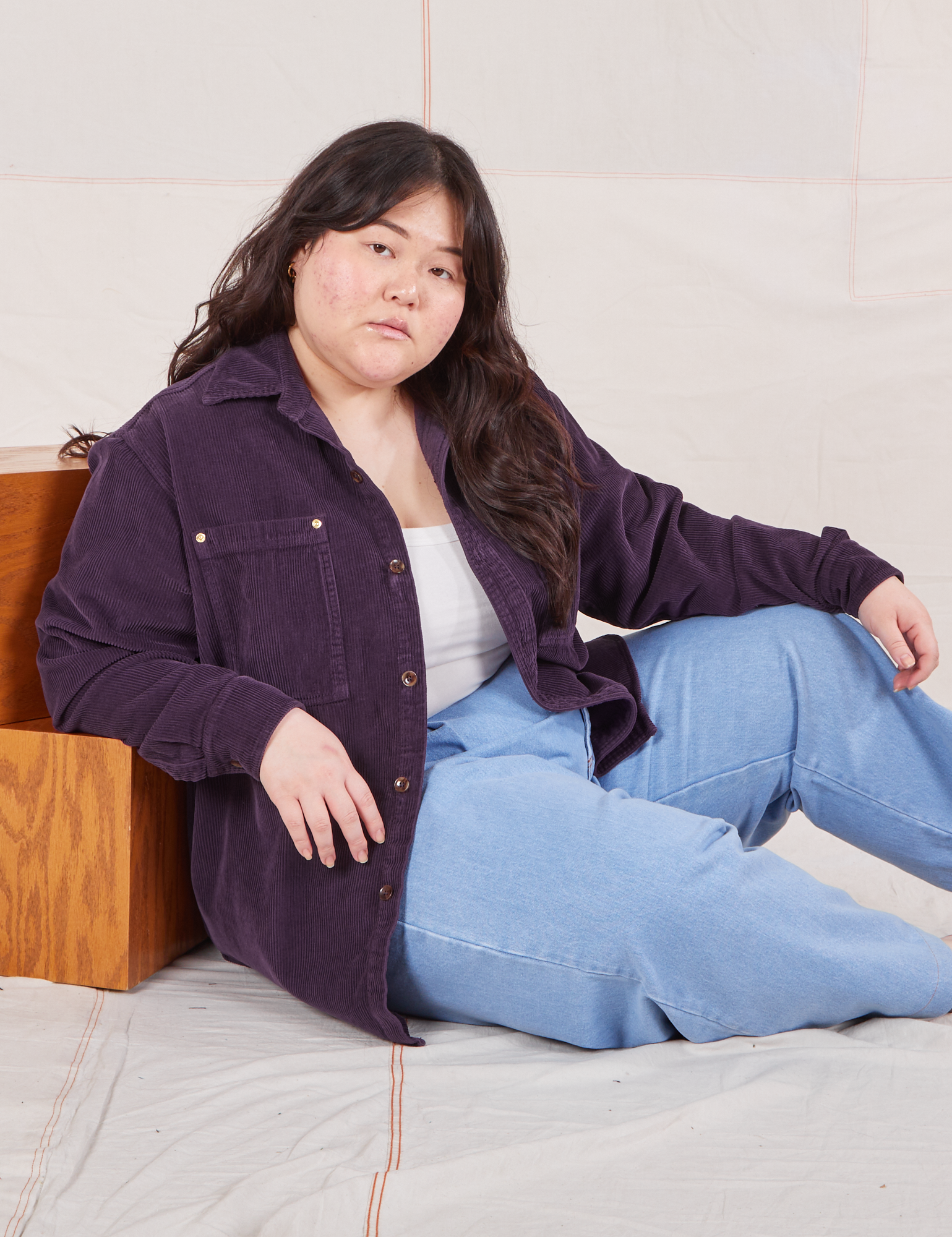 Ashley is wearing Corduroy Overshirt in Nebula Purple and a vintage off-white Cropped Cami underneath and light wash Denim Trouser Jeans