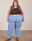 Catie is 5'11" and wearing 4XL Cropped Tank Top in Espresso Brown paired with light wash Denim Trousers