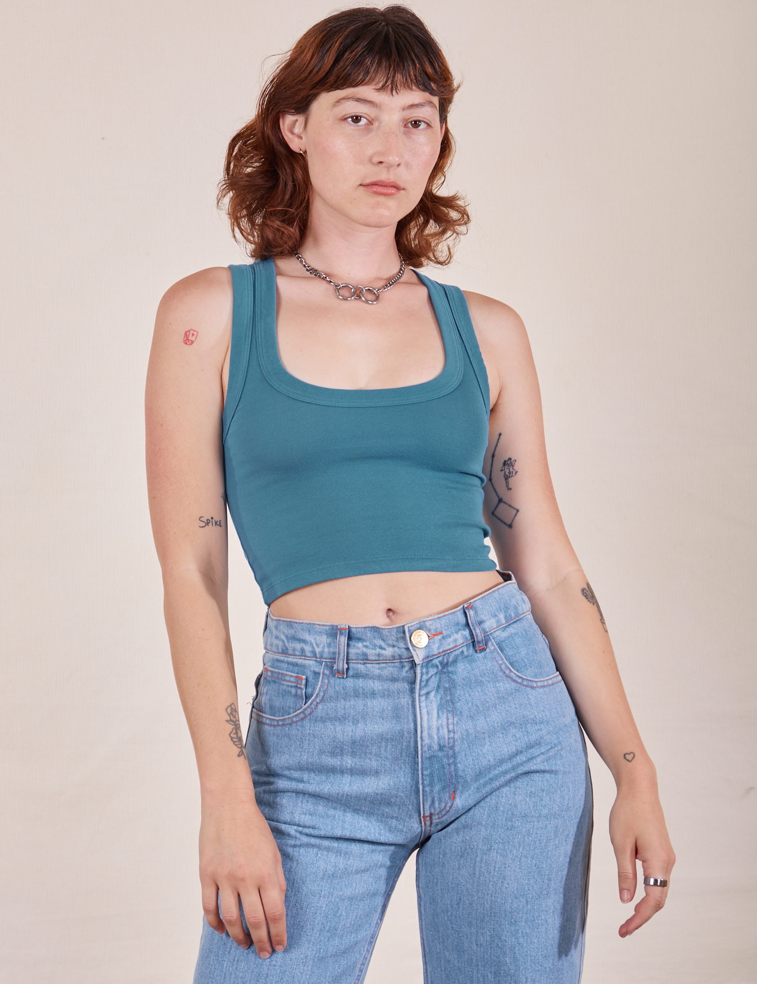 Alex is 5&#39;8&quot; and wearing P Cropped Tank Top in Marine Blue