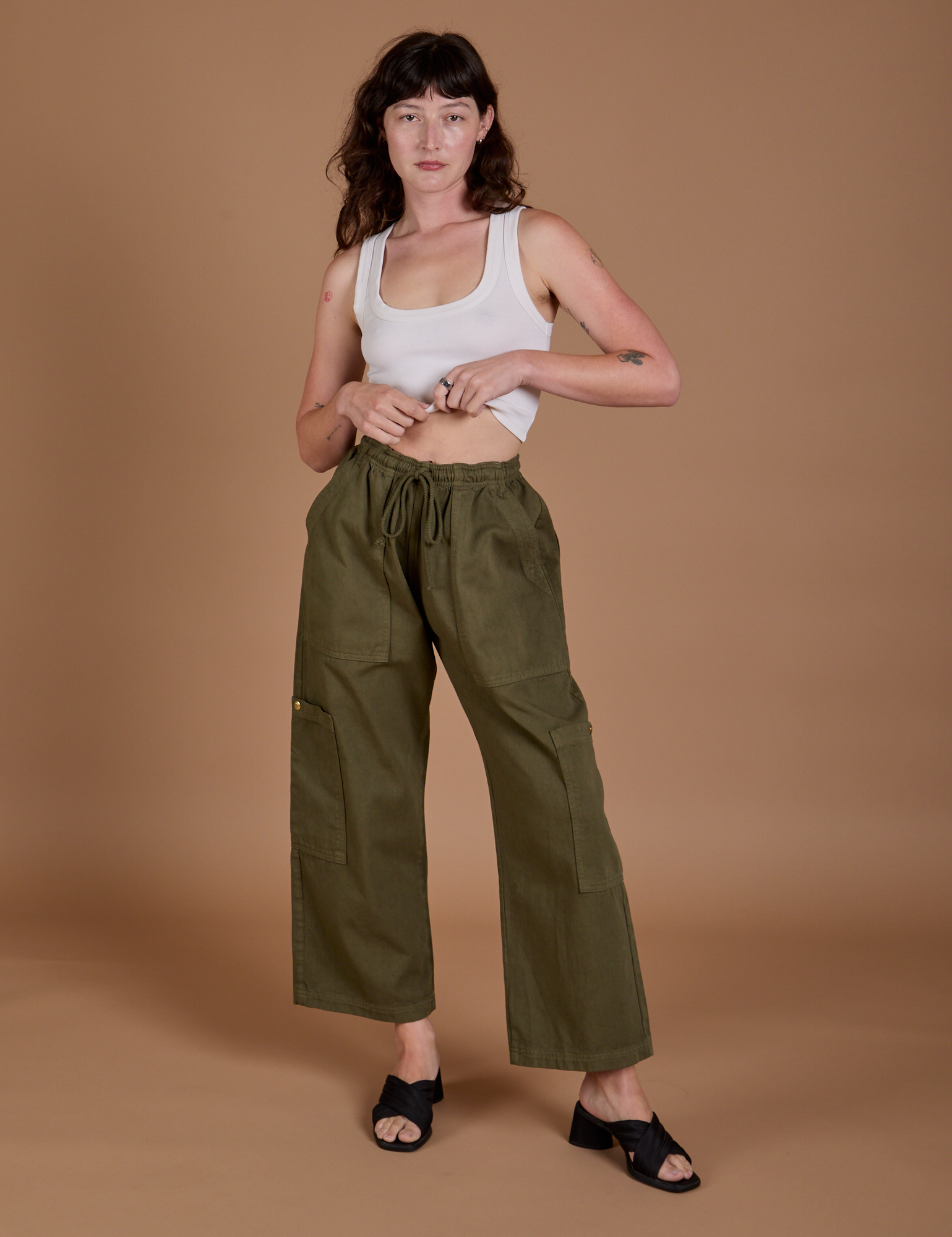Drop Pocket Cargo Pants in Surplus Green and Cropped Tank in Vintage Tee White on Alex