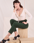 Alex is wearing Easy Pants in Swamp Green and vintage tee off-white Wrap Top.