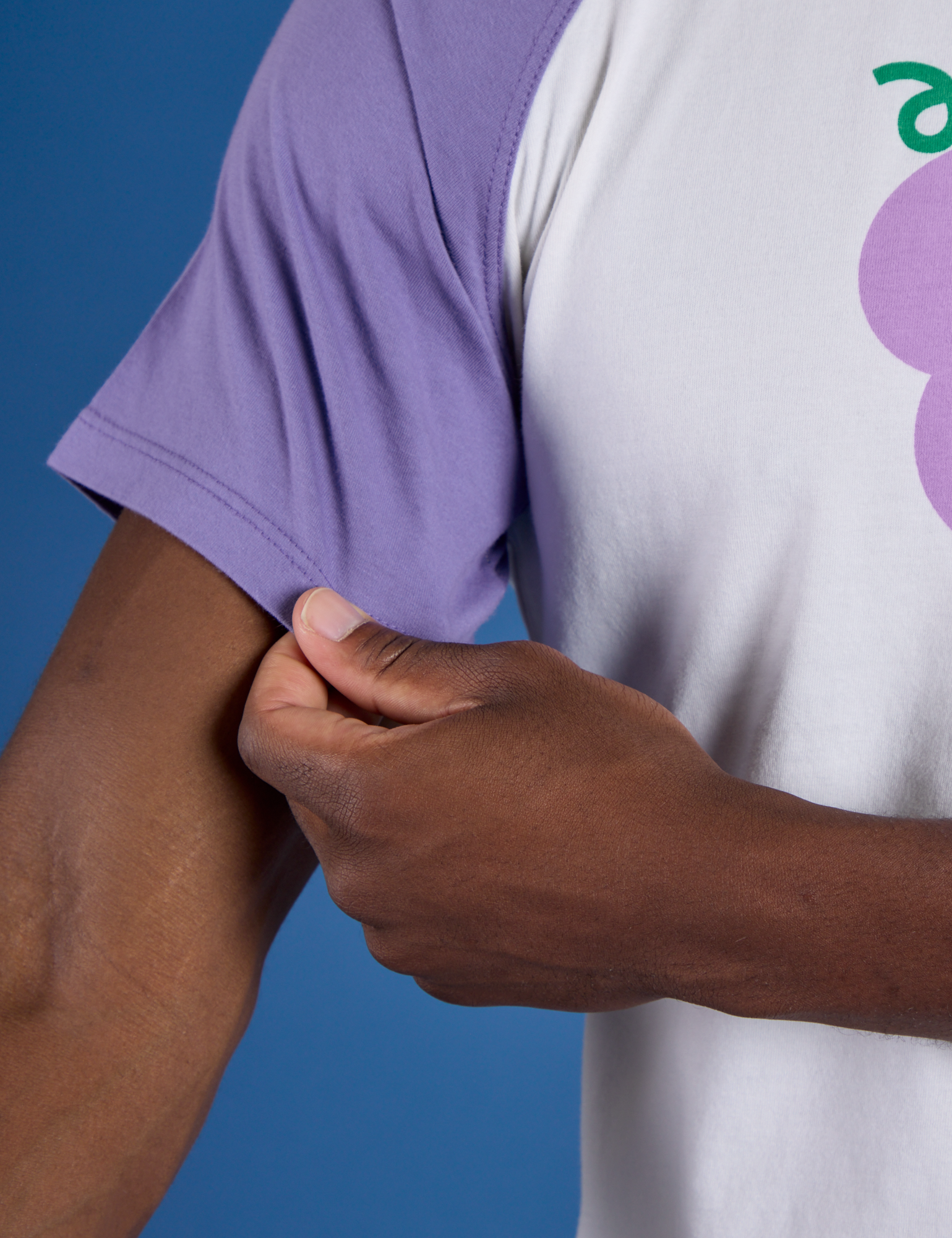 Produce Raglan Tee in Grape sleeve close up on Isaac