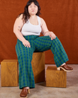 Ashley is wearing Gingham Western Pants in Green and Cropped Tank in vintage tee off-white