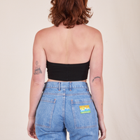 Back view of Halter Top in Basic Black and light wash Frontier Jeans worn by Alex