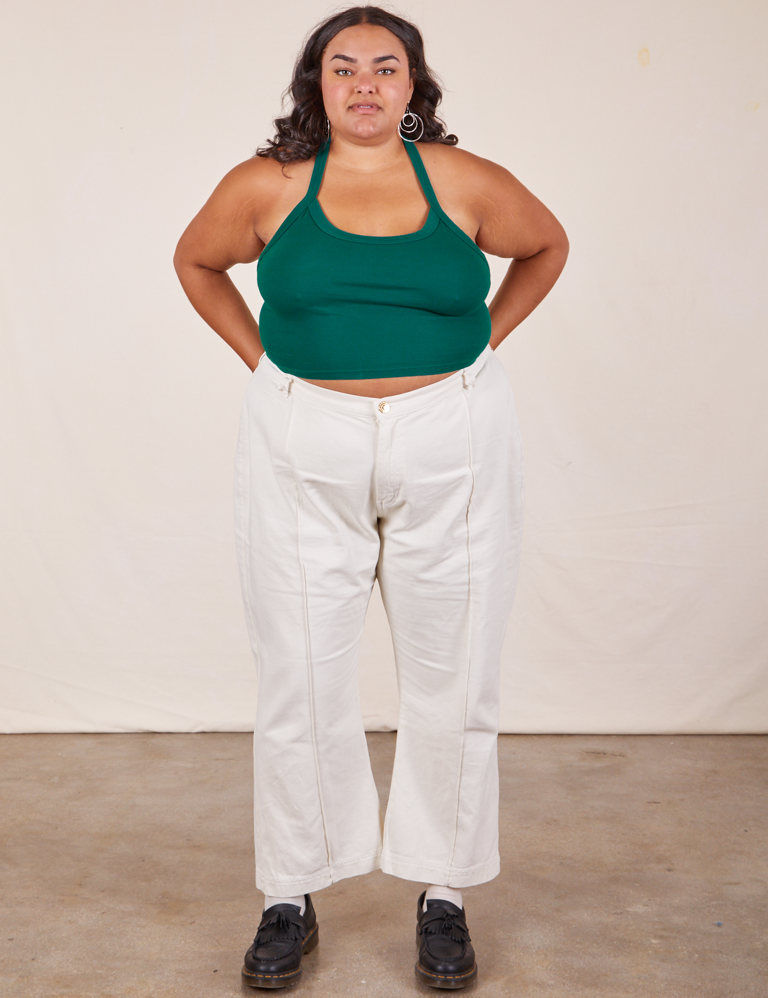 Alicia is wearing Halter Top in Hunter Green and vintage off-white Western Pants