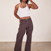 Jerrod is wearing Halter Top in Vintage Off-White and espresso brown Western Pants