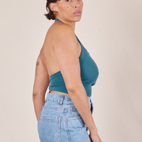 Side view of Halter Top in Marine Blue and light wash Sailor Jeans worn by Tiara