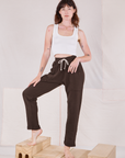 Alex is wearing Rolled Cuff Sweat Pants in Espresso Brown and vintage off-white Cropped Tank