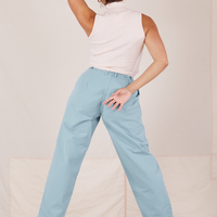 Back view of Heavyweight Trousers in Baby Blue and vintage off-white Sleeveless Turtleneck worn by Tiara
