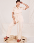 Tiara is 5'4" and wearing S Heritage Short Sleeve Jumpsuit in Natural