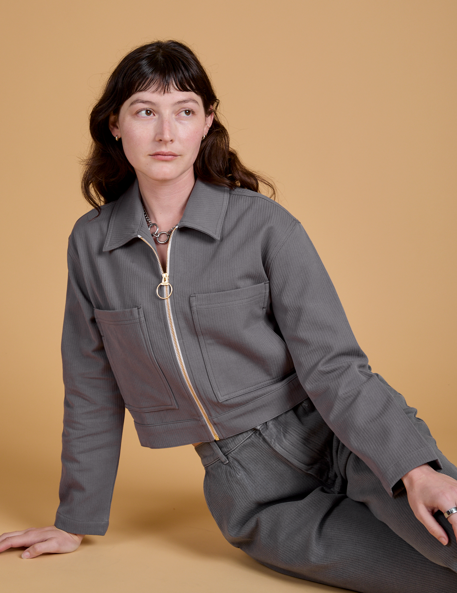 Alex is wearing Heritage Mechanic Jacket in Washed Grey