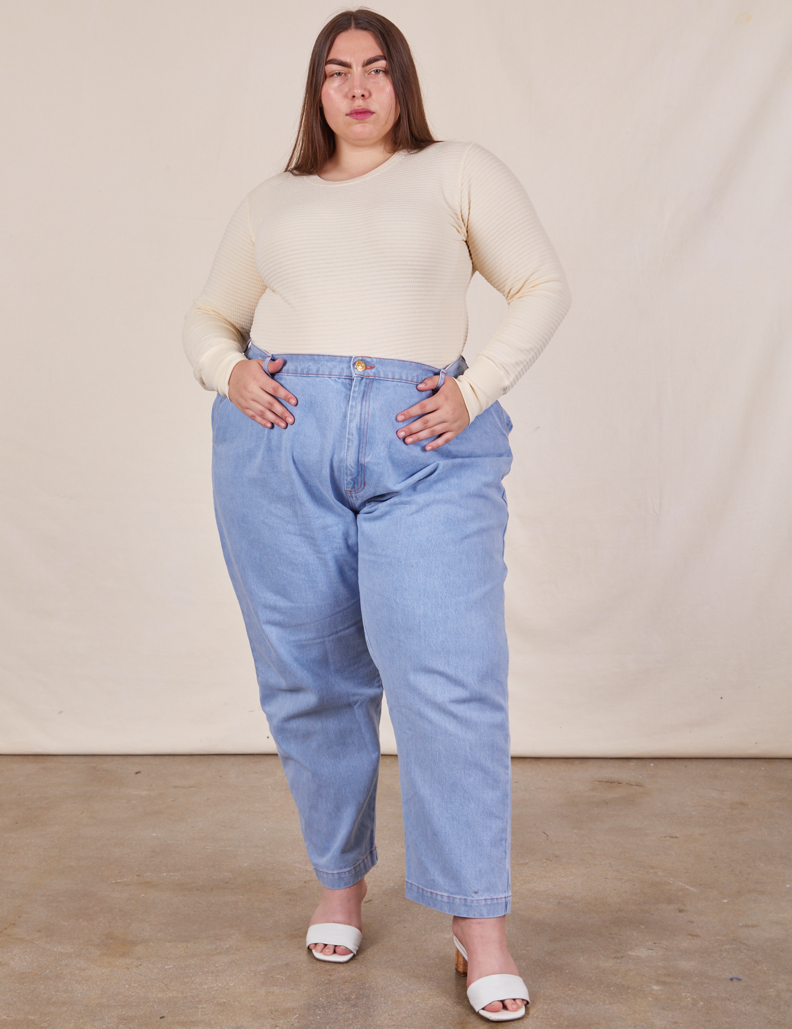 Marielena is wearing Honeycomb Thermal in Vintage Off-White and light wash Denim Trousers