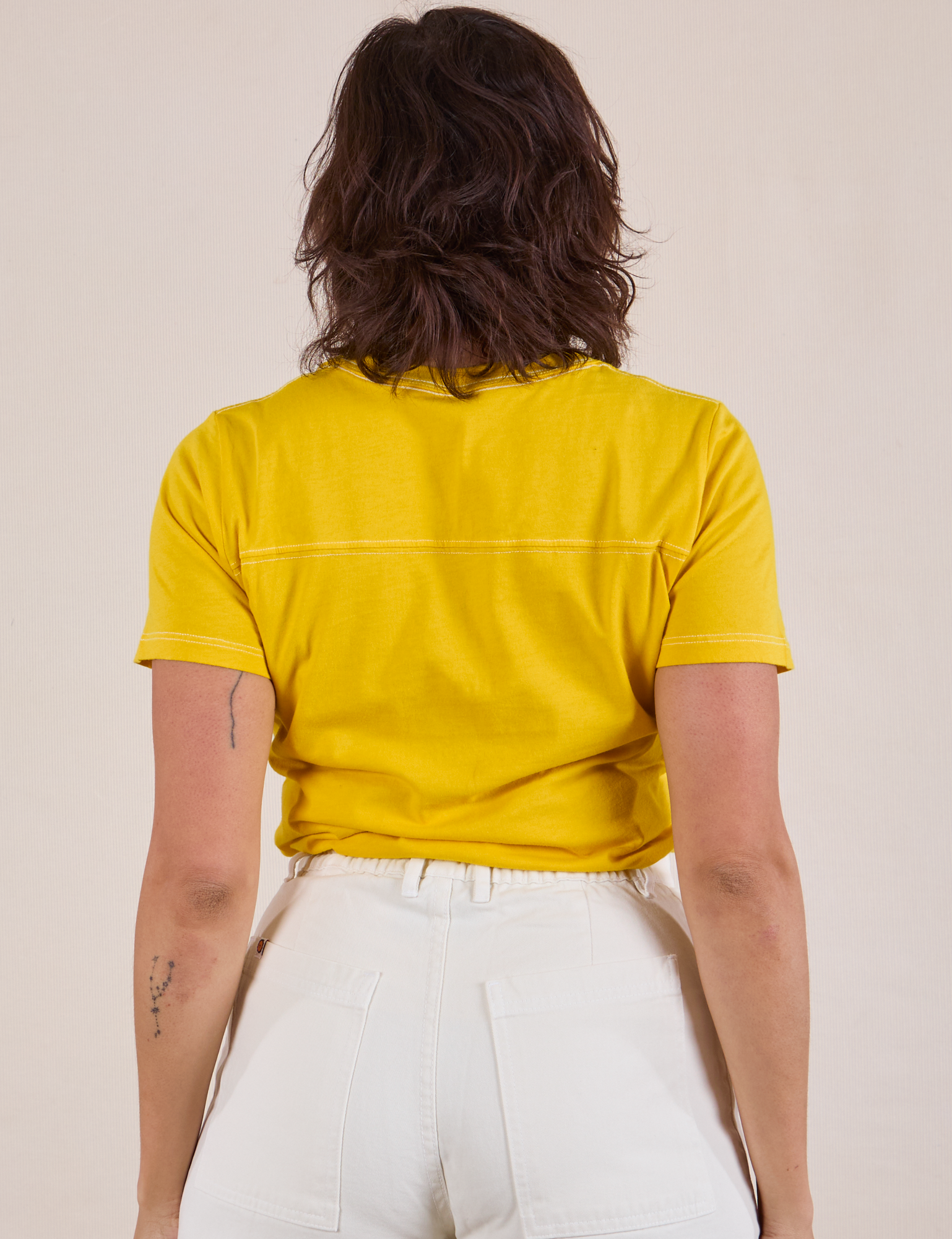 JV Tee in Golden Yellow back view on Tiara