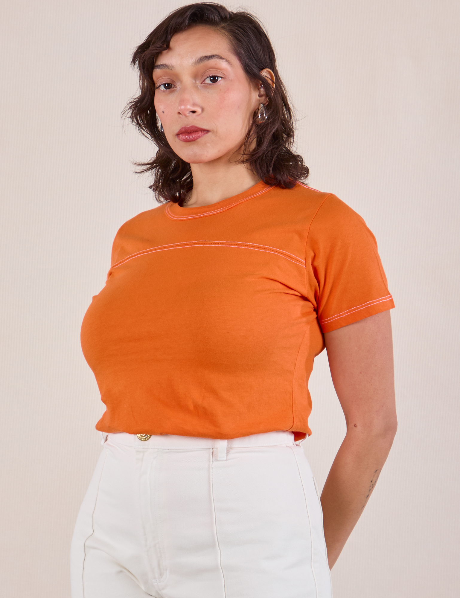 JV Tee in Construction Orange angled front view on Tiara