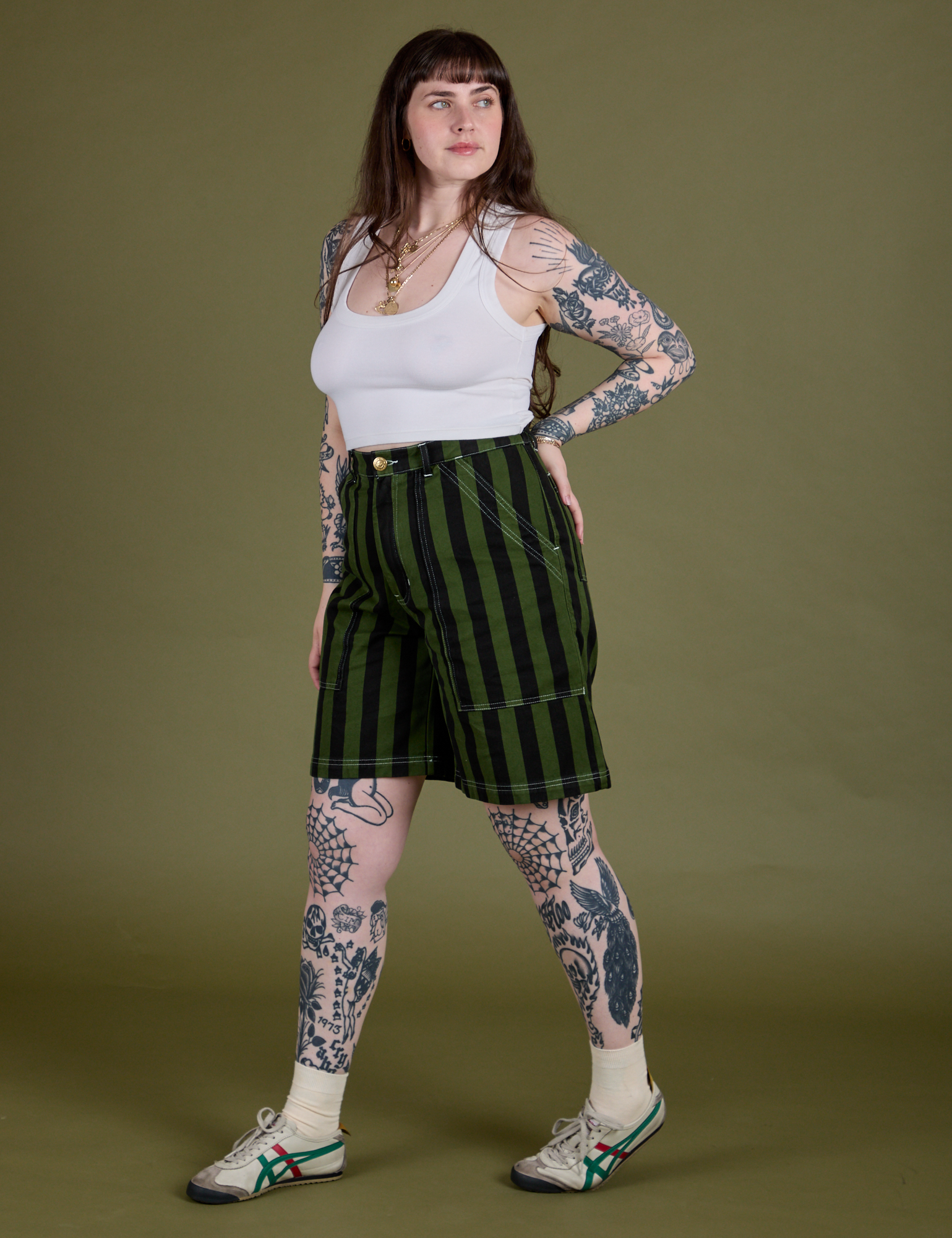 Angled front view of Longline Work Shorts in Evergreen and Cropped Tank in Vintage Tee White
