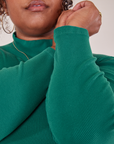 Essential Turtleneck in Hunter Green sleeve close up on Morgan