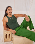 Anthony is wearing Racerback Tank in Swamp Green and lawn green Trousers