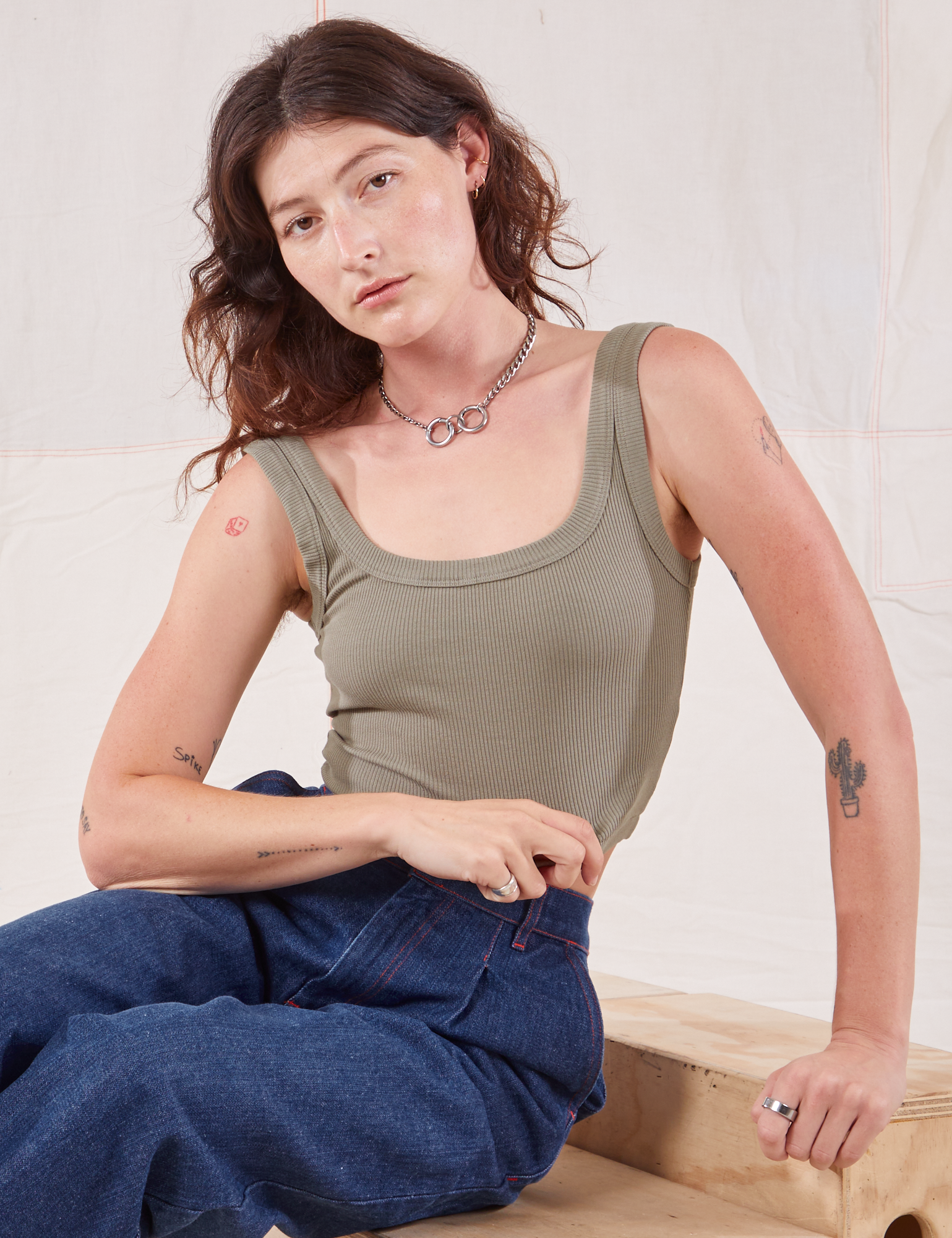 Alex is wearing Square Neck Tank in Khaki Grey