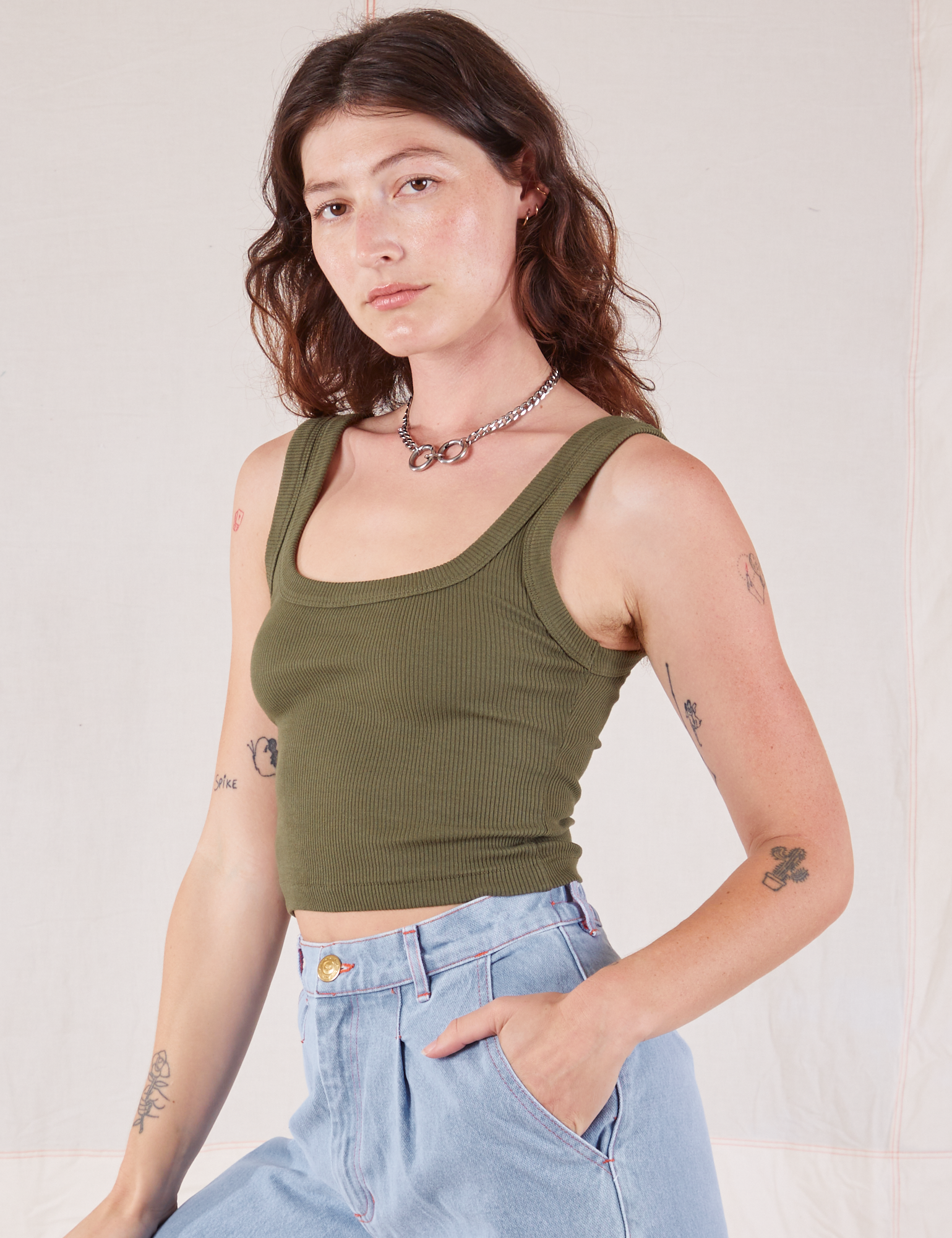 Square Neck Tank in Surplus Green angled front view on Alex