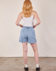 Back view of Denim Trouser Shorts in Light Wash and Cropped Tank in vintage tee off-white on Margaret