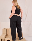 Back view of Mid-Rise Pleated Trousers in Basic Black and black Cropped Tank