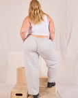 Back view of Mid-Rise Pleated Trousers in Stone White and Cropped Tank in vintage tee off-white