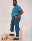 Side view of Mid-Rise Work Pants in Lagoon and marine blue Organic Vintage Tee 