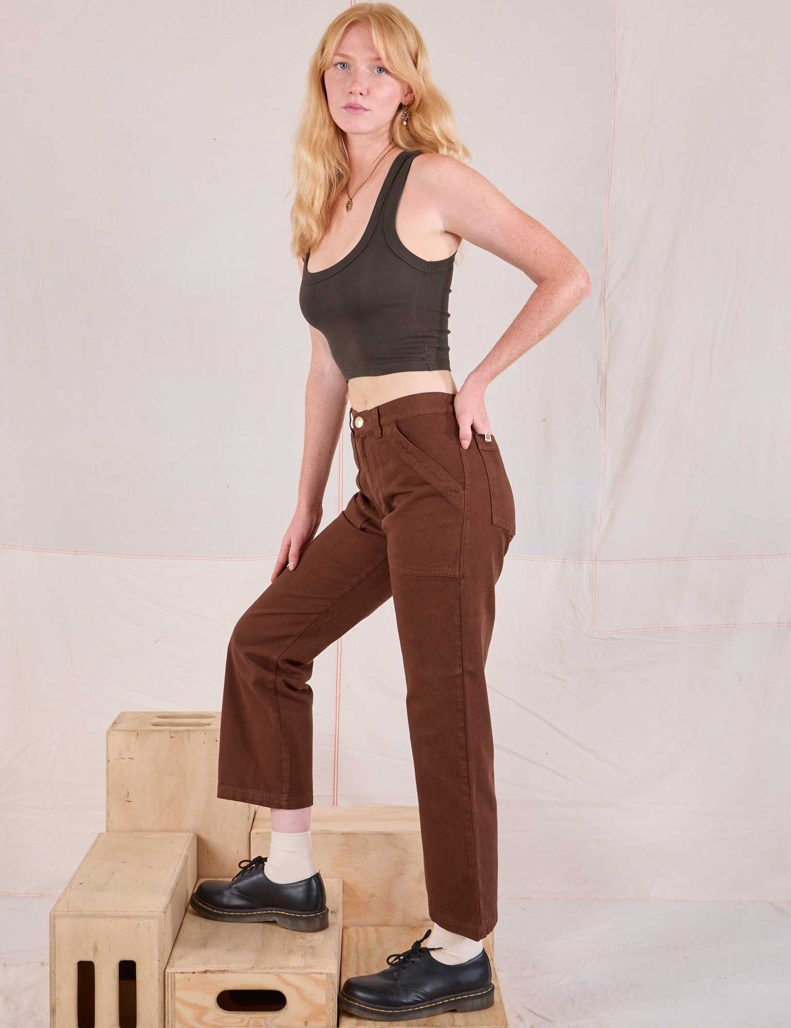 Side view of Mid-Rise Work Pants in Fudgesicle Brown and espresso brown Cropped Tank on Margaret