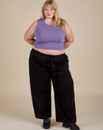 Juliet is wearing Muscle Tee in Faded Grape and black Drop Pocket Cargo Pants