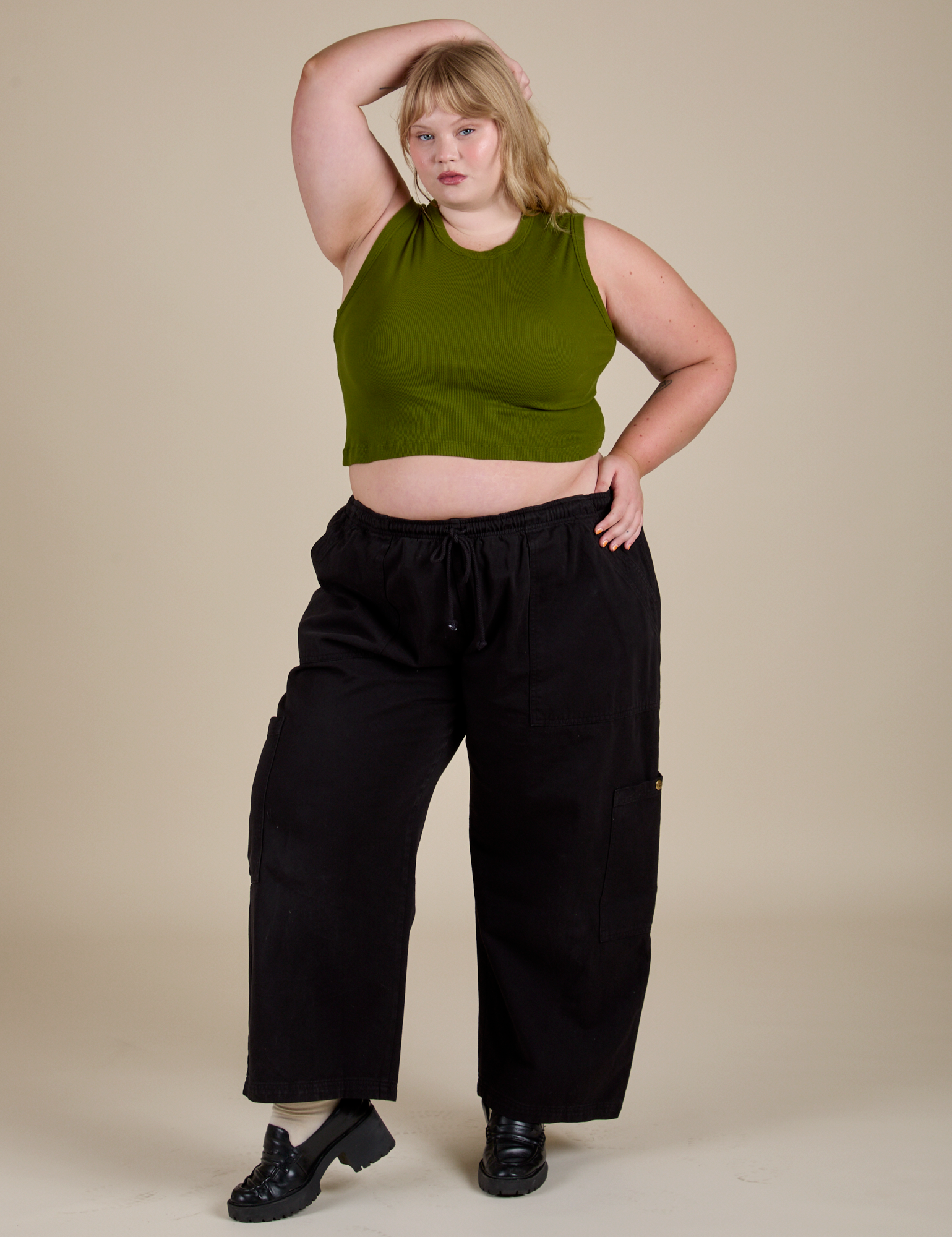 Juliet is wearing Muscle Tee in Summer Olive and black Drop Pocket Cargo Pants